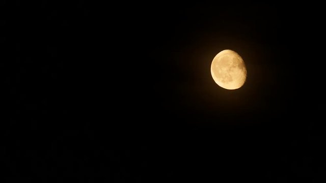 Moon rise in the dark sky, real-time.