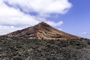 Fototapeta na wymiar Red volcano - Timanfaya National Park / Lanzarote / Canary Islands