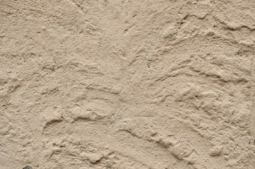 Cconcrete wall with large strokes of plaster