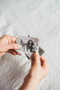 Woman Looking at Old Photographs