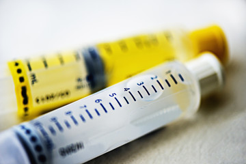 Close up of pre filled saline and heparin syringes for IV administration