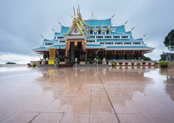 Wat Pa Phu Kon in rainy season with reflection , Udon Thani , Thailand