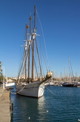 Fototapeta premium Old sailing ship in port of Barcelona
