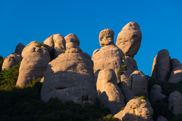 View of the rock formations of El Dit, La Patata and El Lloro in the Montserrat mountains