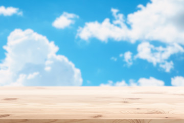Fototapeta premium blue summer sky cloud background with wood floor for display nature products clean fresh air concept