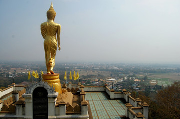View point and buddha walking statue at Wat Phra That Khao Noi temple