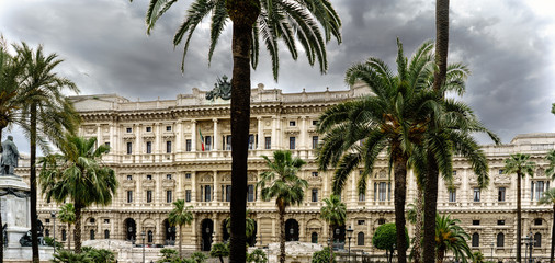 View of Piazza Cavour with the facade of the Supreme Court of Cassation in Rome, Italy. Sky with many dark clouds