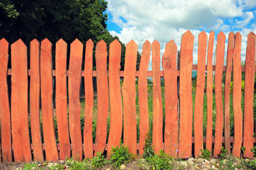 Garden fence of wooden boards