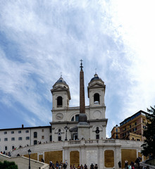 Rome, Lazio, Italy. May 22, 2017: View of the Catholic church called "Trinita dei Monti" and the obelisk called "Salustiano" from the staircase called "Scalinata di Trinità dei Monti".