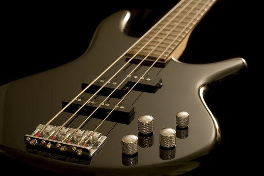 Electric Bass Guitar on Black Background