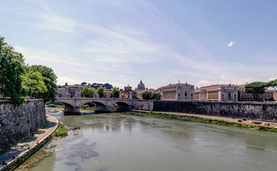 View of the river Arno and the Vittorio Emanuele II bridge, from the bridge of San Angelo. With a magnificent blue sky