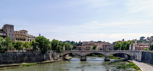 View of the river Arno and the Vittorio Emanuele II bridge, from the bridge of San Angelo. With a magnificent blue sky