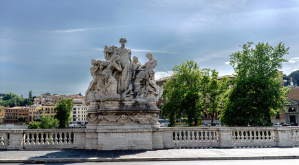 Fototapeta premium Rome, Lazio, Italy. July 25, 2017: Detail of statue located on the parapet of the bridge of San Angelo on the river Tiber with a clear sky