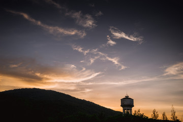 Fototapeta na wymiar Water tower with sunset.
