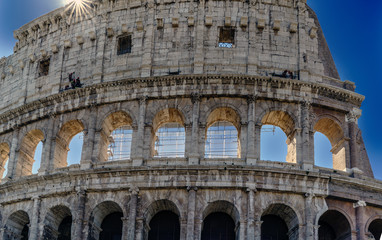 Obraz premium View of the Roman Coliseum from the street called 