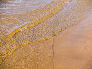 sea surf on a sandy beach. waves, water, sand