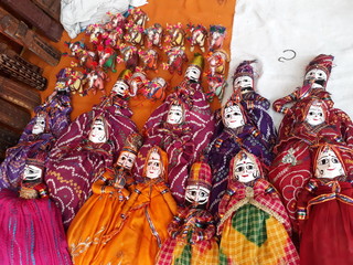 Handmade Rajasthani puppets in a cultural market in North India.