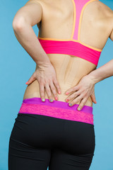 Woman with medical kinesio taping on back