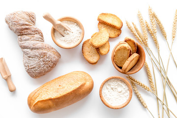 baking fresh wheaten bread on bakery work table background top view