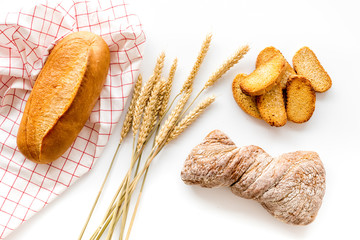baking fresh wheaten bread on bakery work table background top view
