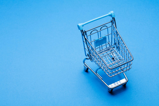 Shopping cart on a blue background