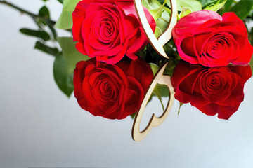 Red roses with heart with reflection in mirror. Valentine's day theme. Romantic moments.