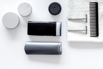 Cosmetics for men's hair on white background top view