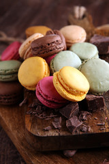 Close up colorful macarons dessert with vintage pastel tones