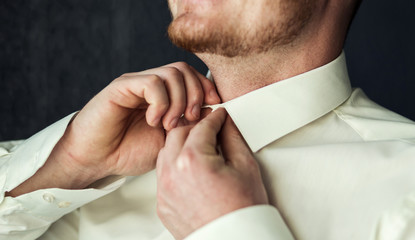 Businessman dress shirt. The man in the white shirt in the window dress cufflinks. Politician,...