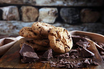 Chocolate cookies on wooden table. Chocolate chip cookies shot