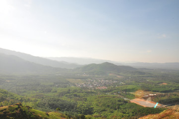 Scenery landscape view of mountain peaks on a horizon. The image contains soft focus when view at full resolution