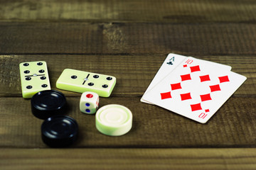 Various board games chess board, playing cards, dominoes. Hobby. Metaphor for games and gambling.