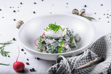 Healthy Breakfast with Wholemeal Bread Toast and Poached Egg with Green Salad, Avocado and Peas. Orange Juice and Orange Slices on the Background.