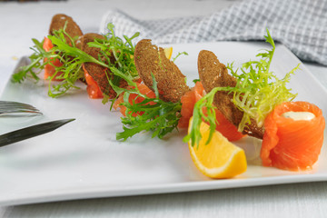 smoked salmon on white plate
