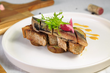 Herring sandwich toast white plate