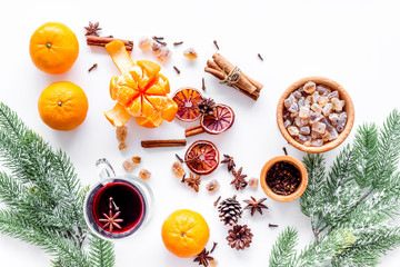 Merry christmas in winter evening with warm drink. Hot mulled wine or grog with fruits and spices...