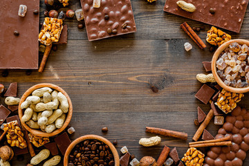 Mockup with chocolate on dark wooden background top view