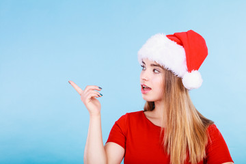 Happy woman wearing Santa Claus helper costume