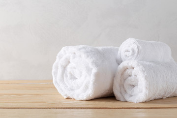 Obraz na płótnie Canvas spa towels on wooden surface