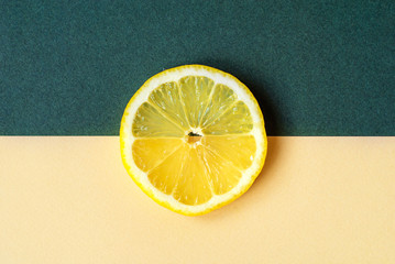 A bright circle of lemon on a yellow-green background.