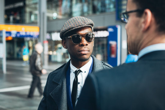 Stylish Young Black Businessman Meeting With Caucasian Businessman on Sunny Spring Day