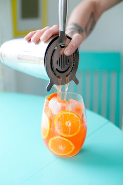 Woman pouring cocktail