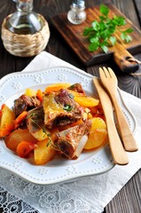 Stewed beef ribs with potatoes, carrots, onions and thyme.