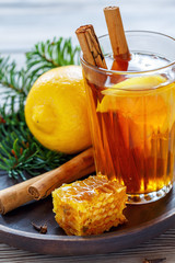 Spicy lemon tea, cinnamon sticks,cloves and honey.