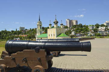 antique ship cannons on the background of the Uspensky (Admiralty) temple. Admiralteysky square, Voronezh city, Russia Federation, 14 Aug 2017