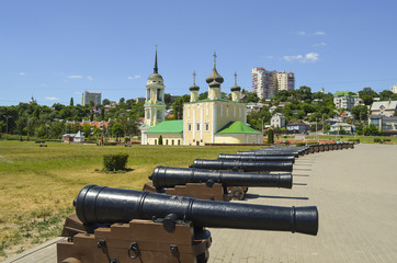 antique ship cannons on the background of the Uspensky (Admiralty) temple. Admiralteysky square, Voronezh city, Russia Federation, 14 Aug 2017