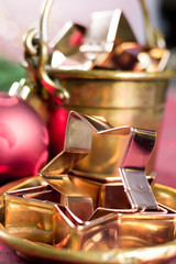 Golden metal cutting forms for christmas star cookies, biscuits, brass or copper