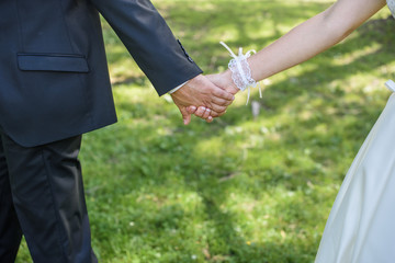 Bride and groom walking and holding hands