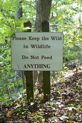KEEP THE WILD IN WILDLIFE - DO NOT FEED ANYTHING sign in state park. Vertical.