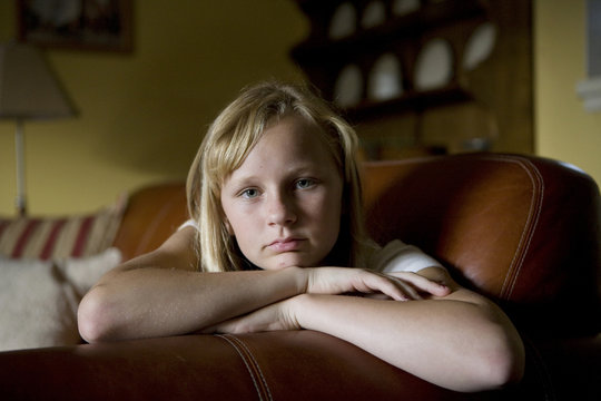 Beautiful Blonde Teen Resting Her Head on Couch